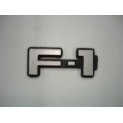 Emblema F-1 Plástico